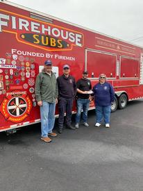 Pictured receiving the check are HTFD District President Frank Rinkevich, HTFD FF Dan Wegrzynowicz, Firehouse Subs Food Truck/owner Jamie Mullen, HTFD Tabby Sipper, Fundraiser Organizer

